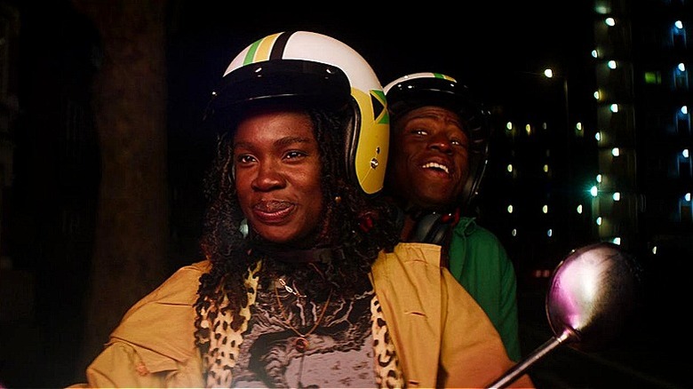 Dom and Yas riding a moped in Rye Lane (2023)