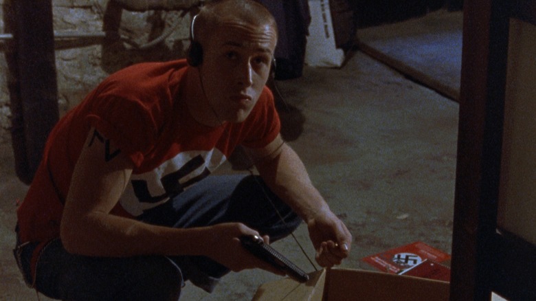 Danny Balint sorting through his Nazi knick-knacks in "The Believer"