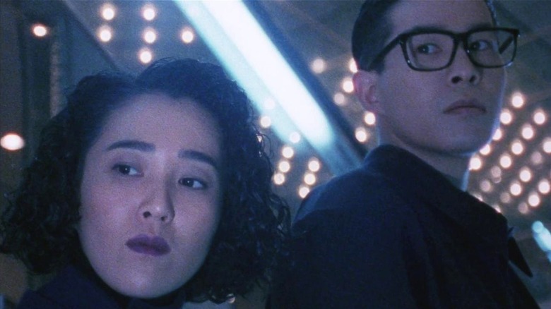 Tomoo and Kana looking to the side in 