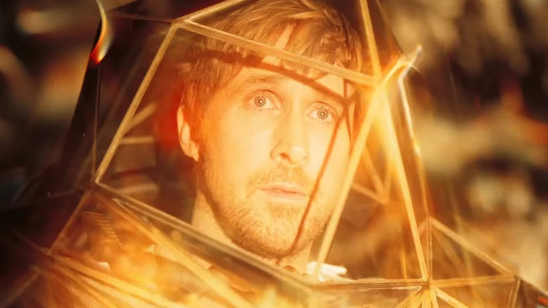 Ryland Grace in a spacesuit, basked in an orange glow in "Project Hail Mary"