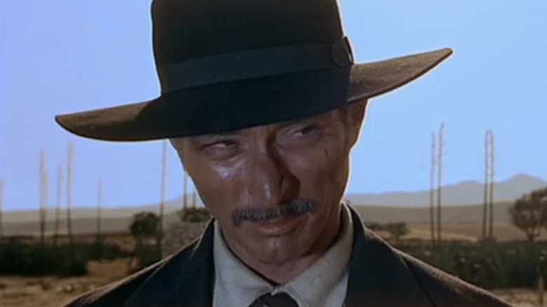Colonel Douglas Mortimer with a black hat and a mustache in For a Few Dollars More