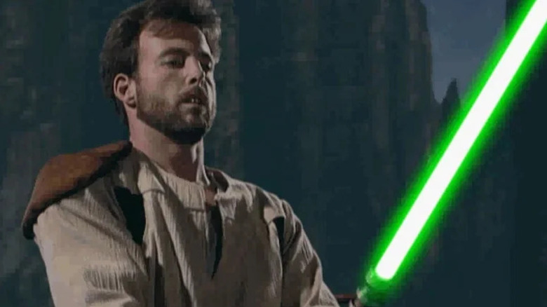 Kyle Katarn holding a green lightsaber in "Star Wars Jedi Knight: Dark Forces II"
