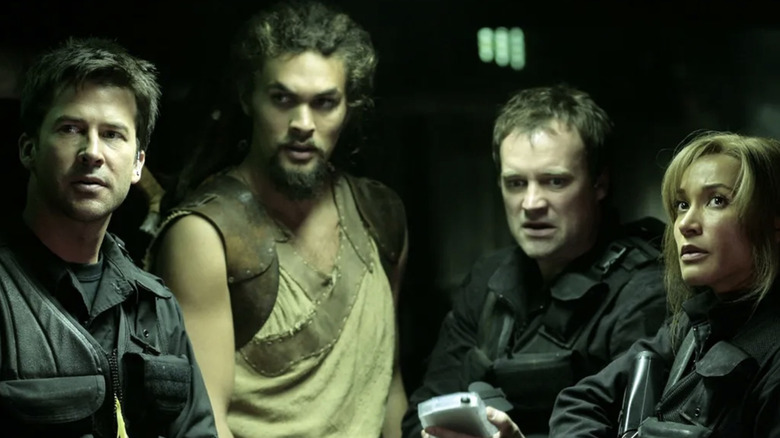 Col. John Sheppard, Ronan Dex, Dr. Rodney McKay, and Teyla Emmagan prepared for battle on 