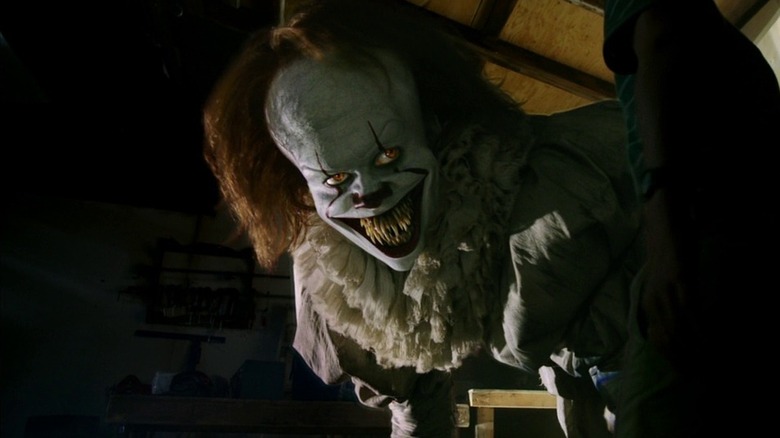 Pennywise grinning in the dark in "It"