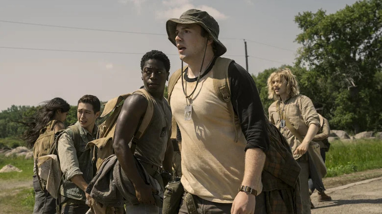 A group of boys walking on the road in "The Long Walk"