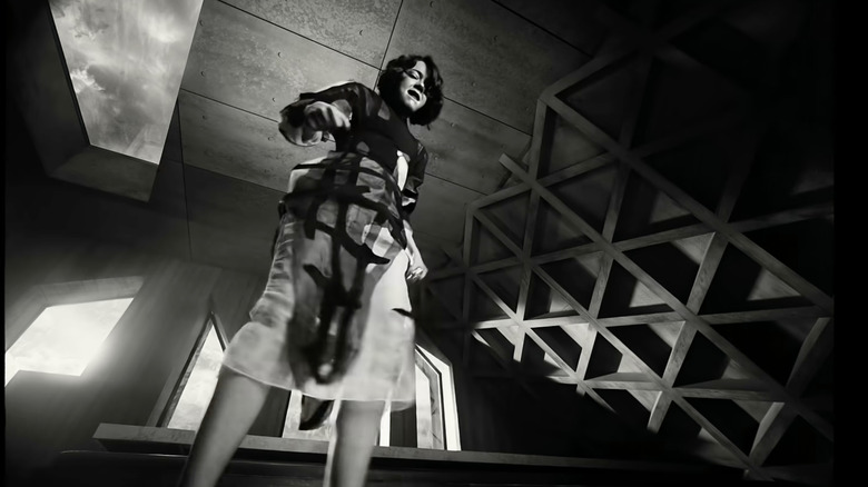 Emma Stone standing over something in black and white in a Squarespace ad