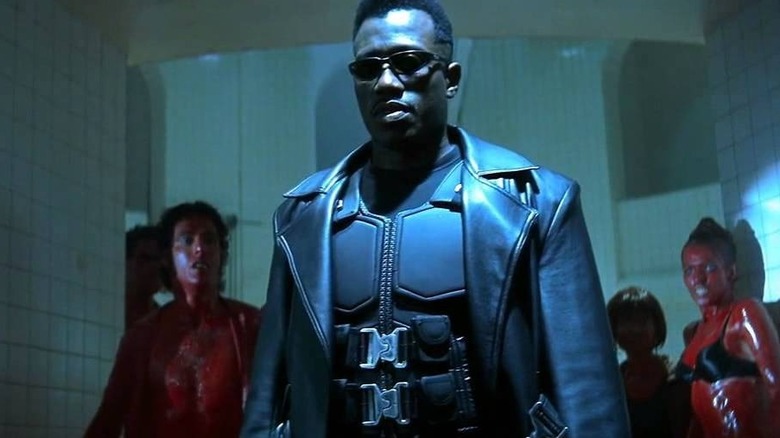 Blade walking past blood-covered vampires in Blade (1998)