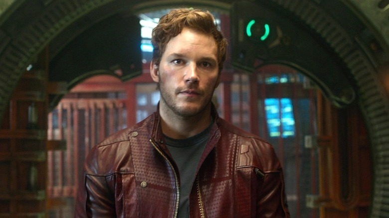 Peter Quill standing in front of an entranceway in "Guardians of the Galaxy" (2014)