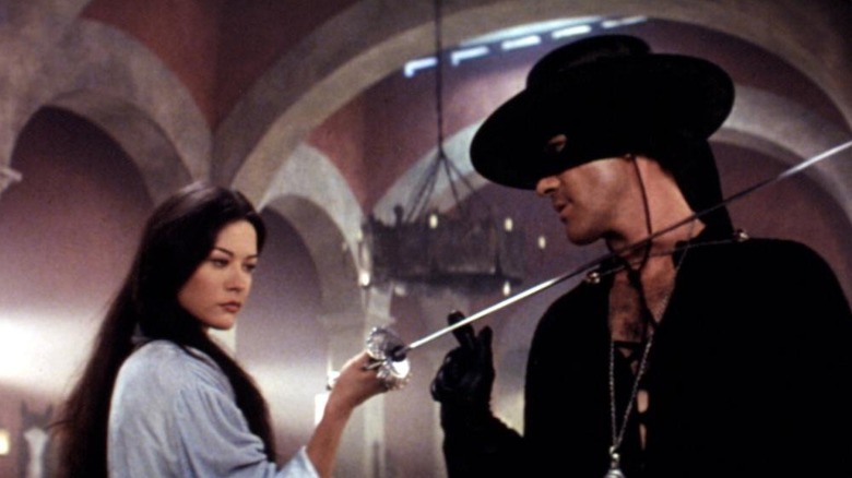 Elena holding a sword against Zorro's throat in "The Mask of Zorro" (1998)
