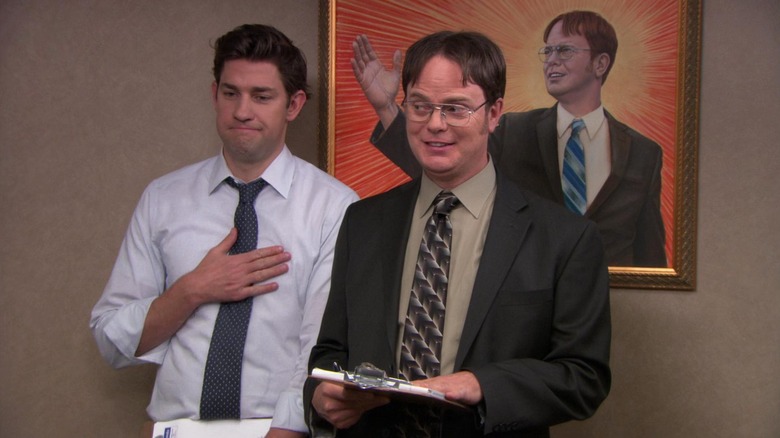 Jim and Dwight in front of a painting of Dwight on The Office