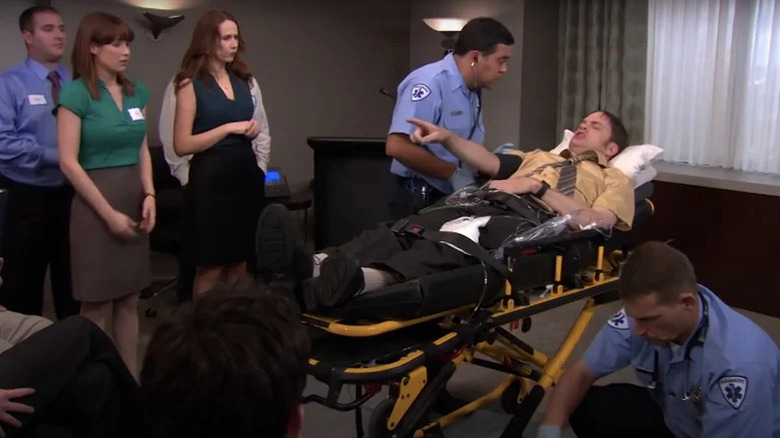 Dwight in a stretcher on The Office