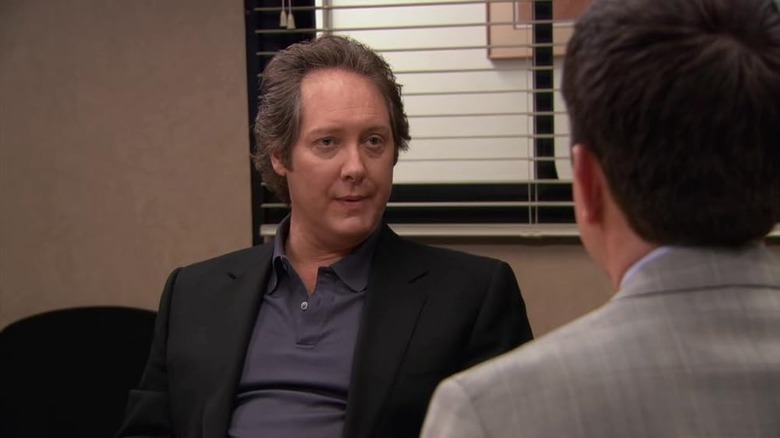 Robert California in an office on The Office
