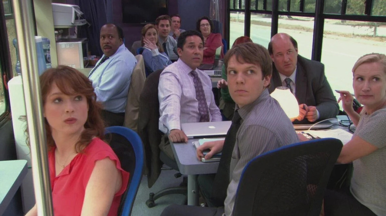 Erin, Stanley, Pam, Jim, Andy, Phyllis, Oscar, Kevin, Pete, and Angela on a bus on The Office