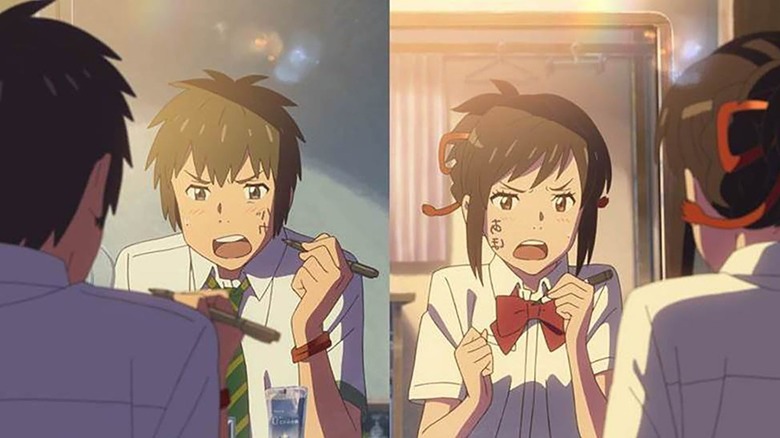Mitsuha Miyamizu and Taki Tachibana getting mad in front of mirrors in "Your Name" (2016)
