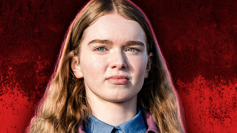 Carrie looking at someone in Carrie with a blood red background