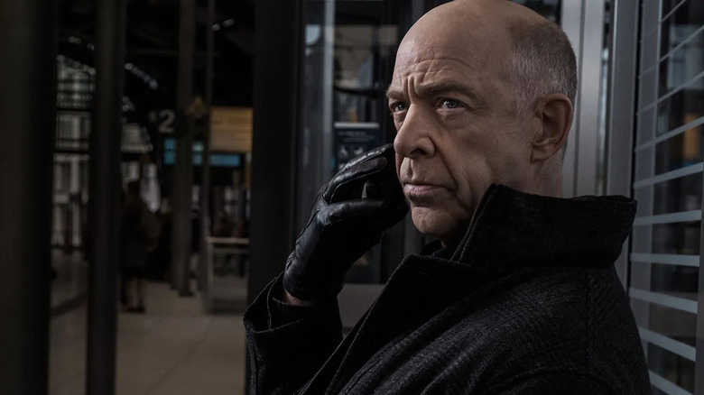 Howard Silk makes a secret phone call in Counterpart