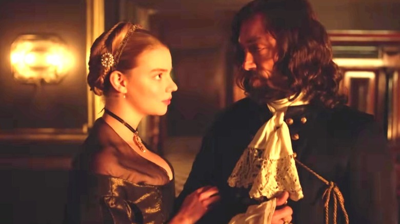 Nella and Johannes Brandt looking at each other on "The Miniaturist" (2017)