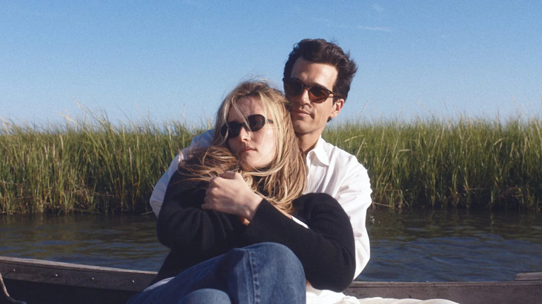 John and Carolyn out on a boat holding each other in Love Story