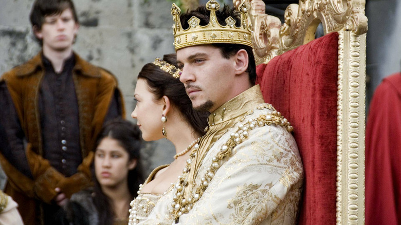 Henry and Anne sitting on a throne in The Tudors