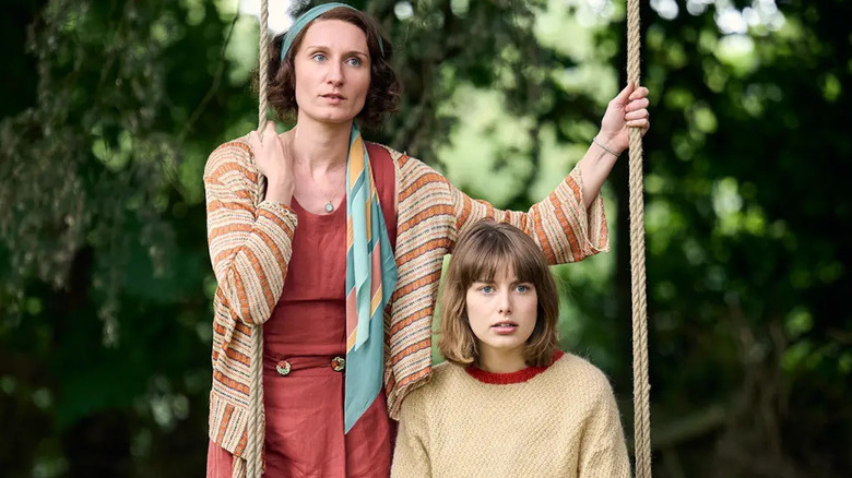 Nancy and Decca on a swing in Outrageous