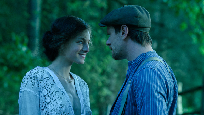 Connie and Oliver look into each other's eyes in "Lady Chatterley's Lover" (2022)