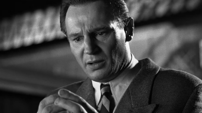Oskar looking at something horrified in Schindler's List