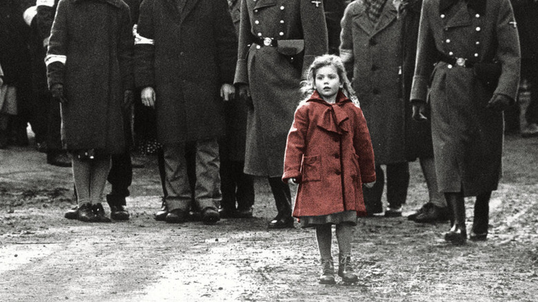The girl in the red coat standing alone in color in Schindler's List