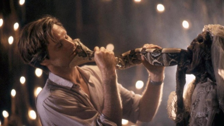 Dr Dennis partaking in a ritual in The Serpent and the Rainbow (1988)