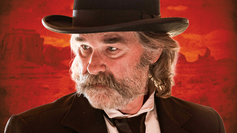 Close-up of Kurt Russell as Sheriff Franklin Hunt in Bone Tomahawk, background of a Western-style desert but with a horror filter over it