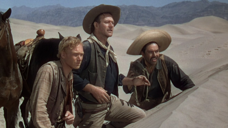 Bob Hightower, Pete and The Abilene Kid look over some dunes in "3 Godfathers" (1948)