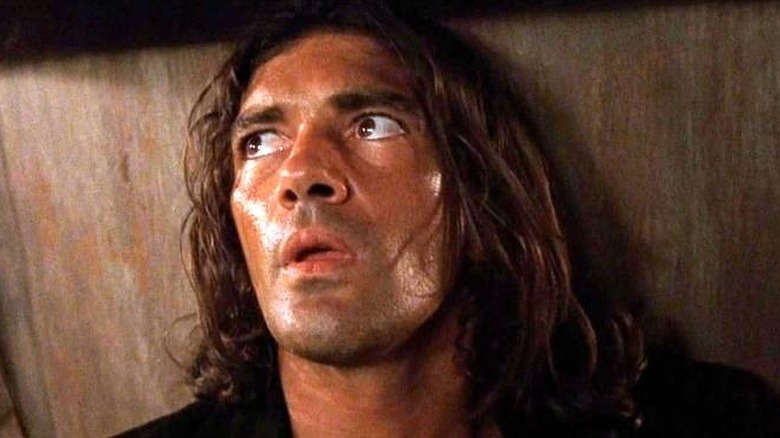 El Mariachi (Antonio Banderas) leaning against a wall in "Desperado."