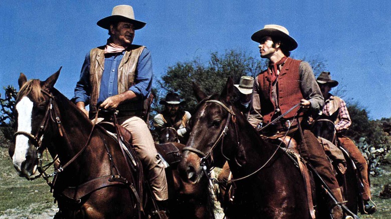 John Chisum and Billy the Kid on horseback in Chisum