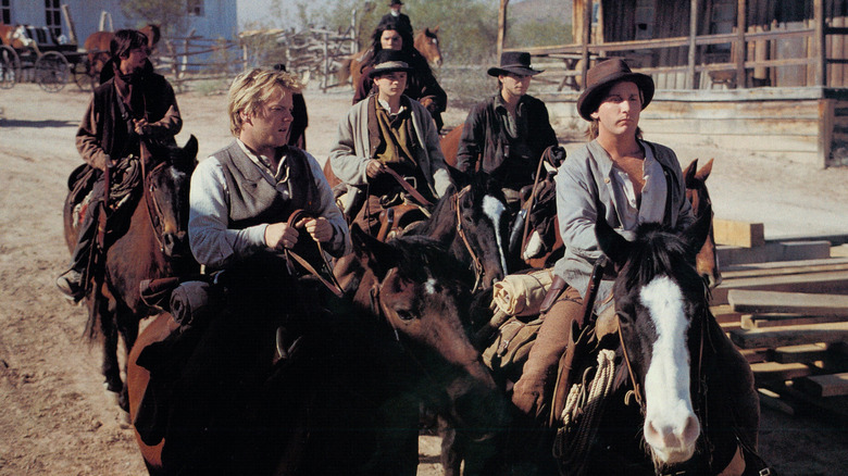 Doc Scurlock and Billy the Kid on horseback in Young Guns