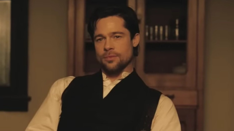 Jesse James wearing a black vest and a white shirt in The Assassination of Jesse James by the Coward Robert Ford