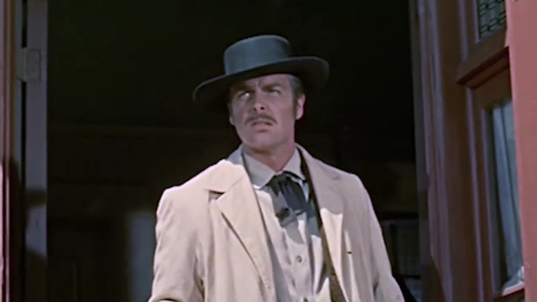 Jesse James wearing a white coat and black hat in The True Story of Jesse James