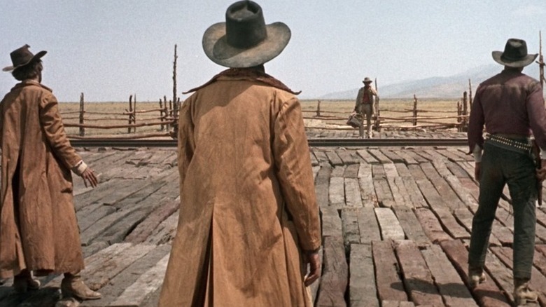 Harmonica (Charles Bronson) arriving at the train station in "Once Upon a Time in the West."