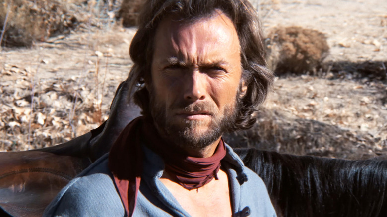 Josey Wales (Clint Eastwood) sitting outside in "The Outlaw Josey Wales."