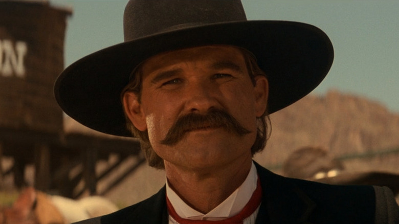 Wyatt Earp (Kurt Russell) smiling in "Tombstone."