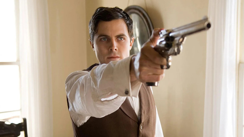Robert Ford fires his gun in "The Assassination of Jesse James by the Coward Robert Ford" (2007)
