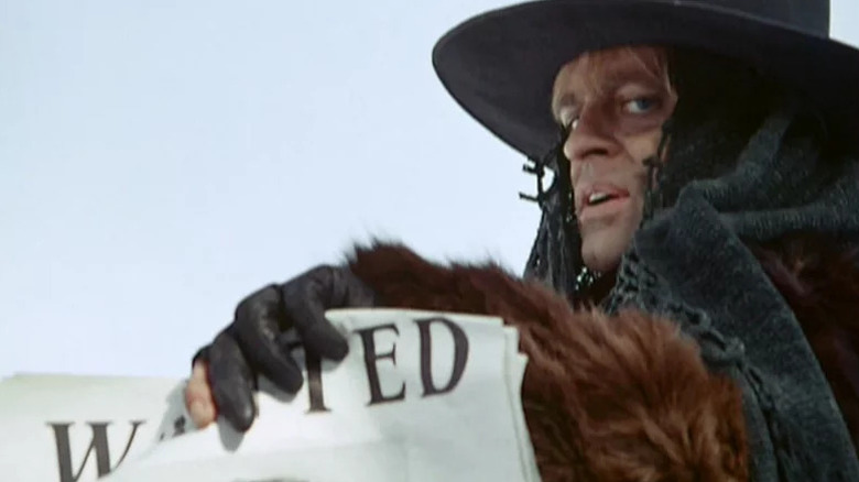 Loco holding a wanted poster in The Great Silence