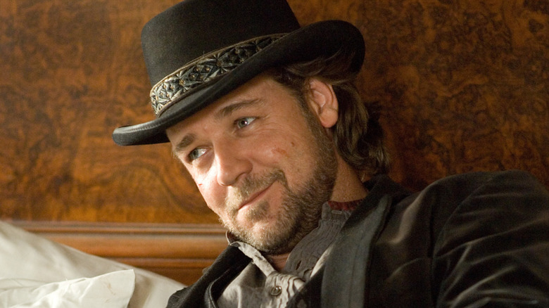 Ben Wade reclining on a bed in "3:10 to Yuma" (2007)