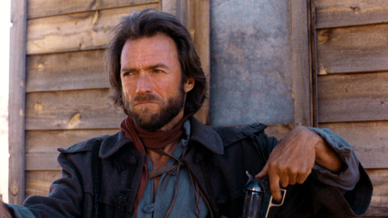 Josey Wales sits in a porch in 'The Outlaw Josey Wales' (1973)