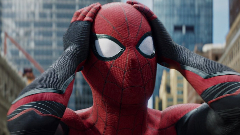 Spider-Man holds his head in confusion in 