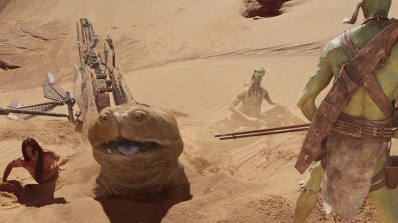 John Carter and Woola surrounded by Thark warriors in John Carter (2012)