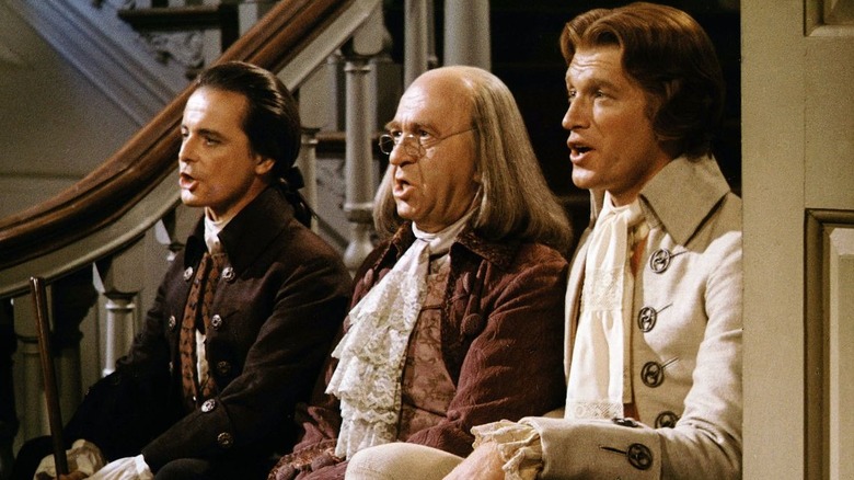 John Adams, Ben Franklin, and Thomas Jefferson sitting on a staircase crooning in "1776" (1972)