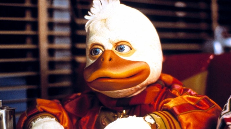 Howard the Duck listening to exposition in a diner in Howard the Duck (1986)