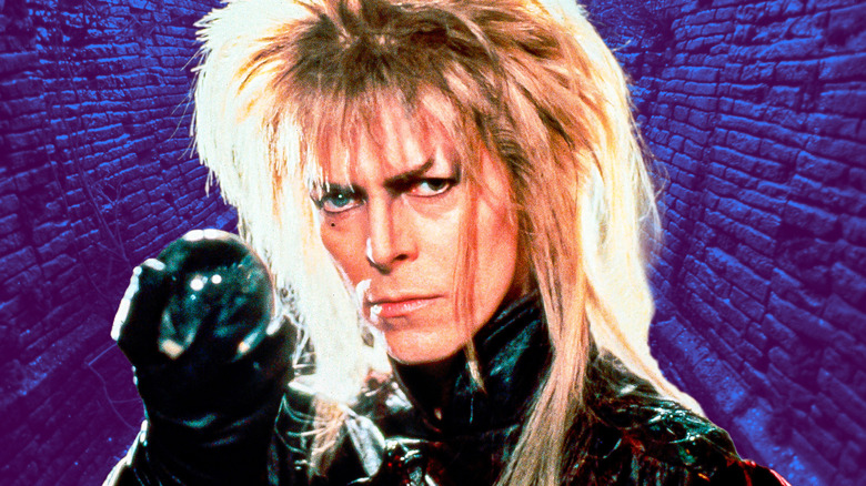 Jareth against a purple, brick wall backdrop