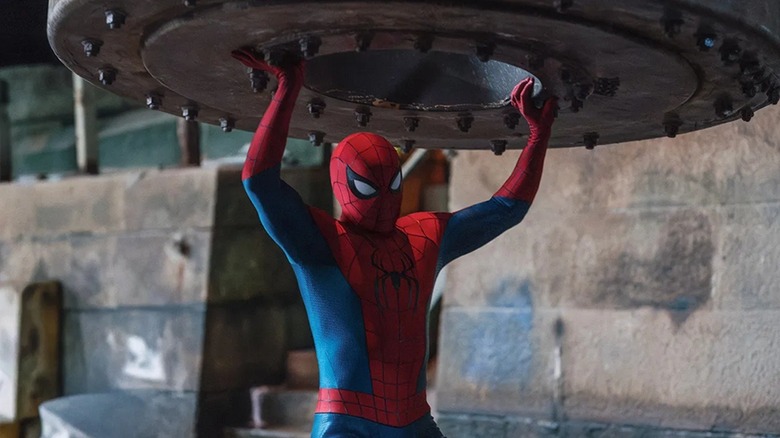 Peter Parker/Spider-Man holding up a tank's entrance in Spider-Man: Brand New Day (2026)