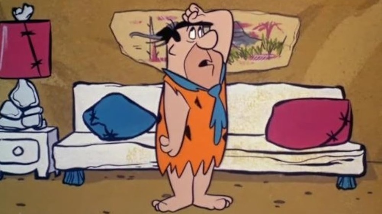 Fred hitting himself on the head in "The Flintstones" (1960)