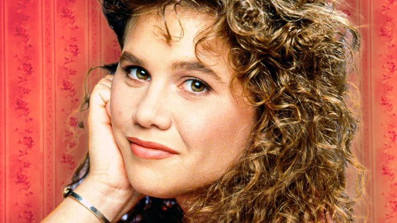 Carol Seaver from Growing Pains looking thoughtful against a red background